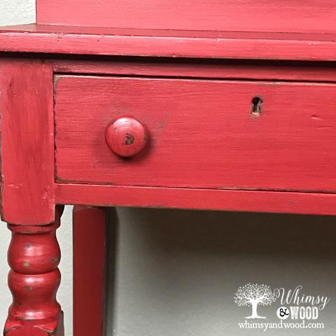 red desk close up of drawer