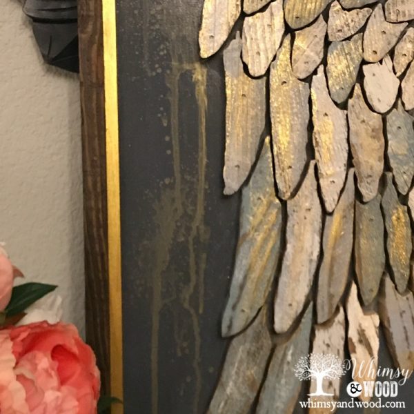 close up of painted scroll saw angel wings