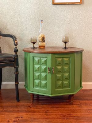 The cutest little vintage side table painted Dublin Green with a Chestnut stained top and feet.